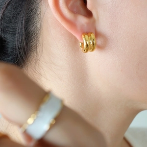 Polished gold double C-shaped stud earrings for women with minimalist vintage style