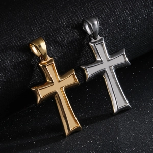 Minimalist stainless steel cross pendants in gold and silver finish on black background