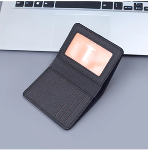 Detail shot of black canvas wallet interior showing three card slots and one ID window
