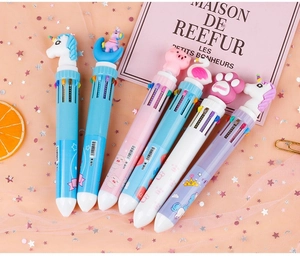 Close-up of 10-color shuttle pens with cute cartoon toppers like unicorn and cat paws