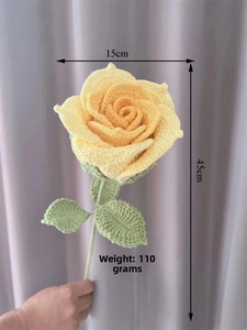 Detail showing a handmade crochet yellow rose with 15cm diameter and 45cm long stem