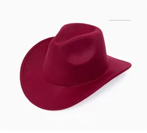 Detail of wine red wide brim fedora hat with classic indented top and wool texture