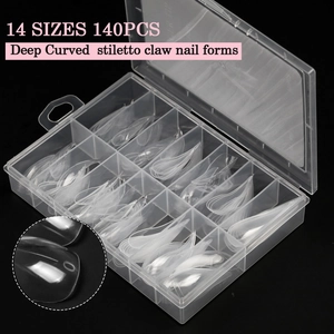 Macro detail of 140pcs deep curved stiletto nail forms with scales in storage box