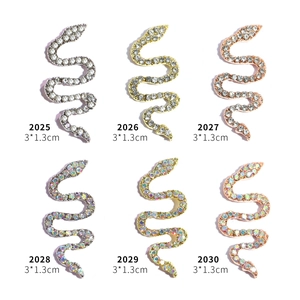 S-shaped snake nail art charms in silver, gold, and rose gold with rhinestones