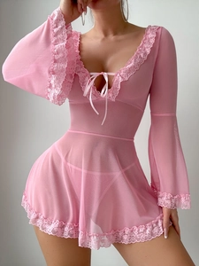 Detailed view of pink lace patchwork, mesh long sleeves, and ribbon bow on teddy lingerie
