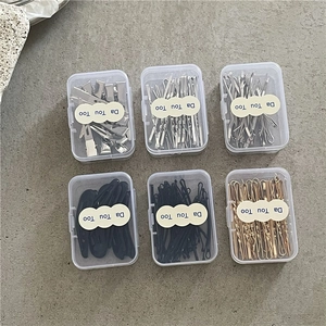 Variety set of metal hair clips and bobby pins in transparent storage boxes