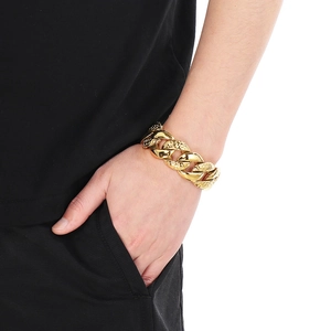 Men's 25mm chunky gold Cuban link bracelet with unique pebble texture and smooth finish