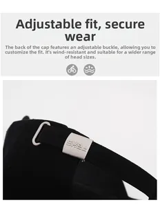 Detail of black cotton baseball cap with adjustable silver metal buckle and engraved logo