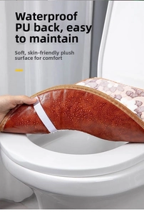 Detail showing waterproof PU leather backing of a plush toilet seat cover with water drops