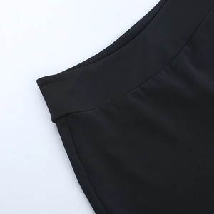 Close-up of waist tailoring and stitching on these black long-sleeve two-piece sets