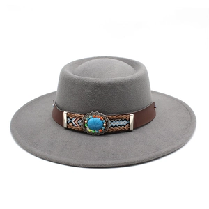Close-up of gray felt boho fedora with turquoise stone and braided ethnic band
