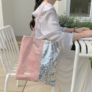Detail view of pink velvet and silver sequin patchwork tote bag with Sazakku label