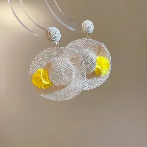 Handmade woven straw hat earrings with yellow floral accents for summer vacation style