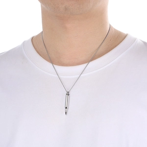 Male model wearing silver bullet pendant necklace with stainless steel cross chain