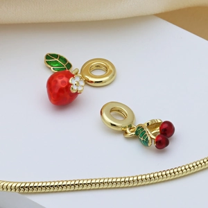 Golden snake chain bracelet with strawberry and cherry enamel pendants and zircons