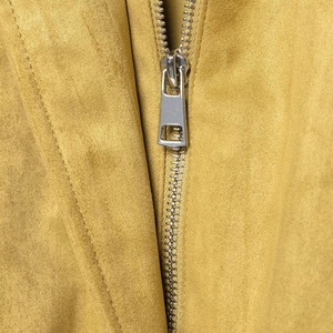 Women's yellow faux suede jacket with metallic silver zipper closure and collar details