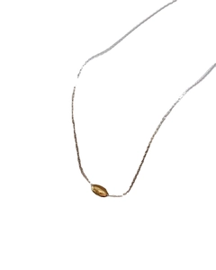 Minimalist silver chain necklace featuring a smooth gold olive leaf shaped pendant charm
