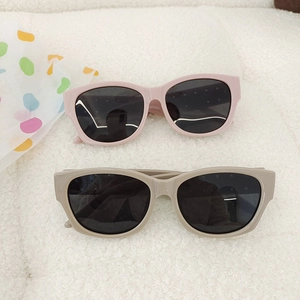 Chic oversized kids sunglasses in pink and khaki with rivet details and UV protection