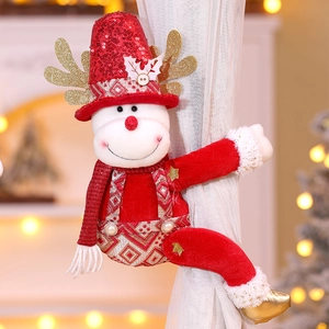 Detailed view of Christmas reindeer curtain buckle with red sequins and gold antlers