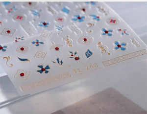 Detailed 5D embossed nail sticker TL-248 with gold edges and navy floral patterns
