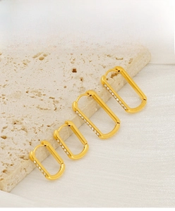 Detail showing four sizes of gold-plated U-shaped earrings with inlaid zircons