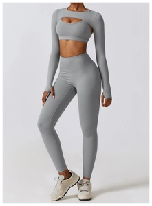 Detailed close-up of gray yoga set fabric texture with breathable thumbhole design