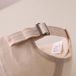 Close-up of kids cotton baseball cap with adjustable metal buckle and quality stitching