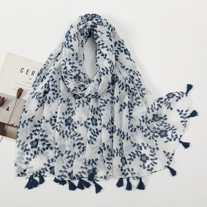 White voile scarf with navy blue floral print and fringe tassels for sun protection