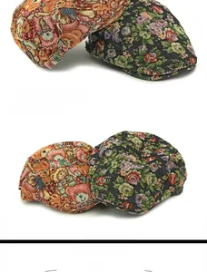 Detail of vintage jacquard berets showing pink bear pattern and floral textures