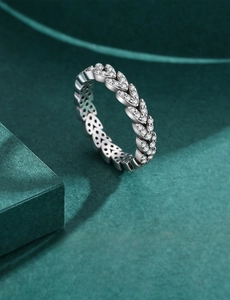 Macro detail of leaf ring in S925 sterling silver with sparkling zircon pavé setting