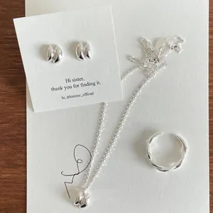 Minimalist 925 sterling silver set featuring pleated stud earrings, necklace, and ring