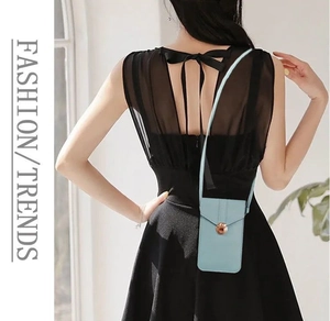 Back view of light blue touchscreen phone bag with metal buckle on black dress