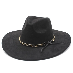 Detail of black wide brim fedora with gold metal chain and black ribbon bow decoration