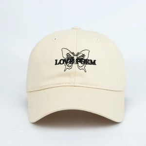 Close-up of butterfly embroidery and Love Poem text on this stylish beige baseball cap
