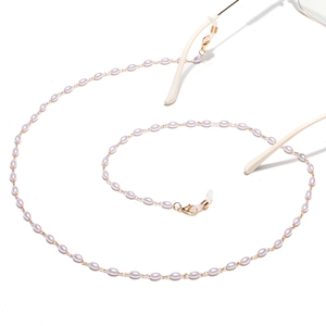 Golden eyewear chain with lavender rice pearls and adjustable rubber non-slip loops