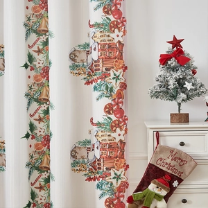 Detail of Christmas themed printed curtain featuring gingerbread house and holiday decor
