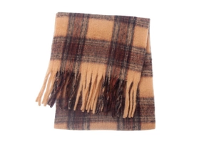 Close-up of thick plaid scarf with orange and brown tassels in wool-like texture
