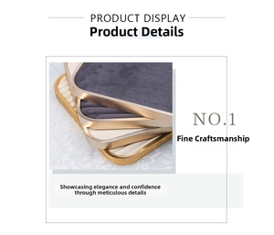 Close-up of golden brushed metal jewelry display trays with velvet lining for rings