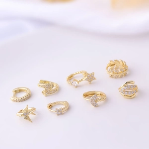 Set of 8 gold geometric earrings with micro-inlaid cubic zirconia in celestial designs