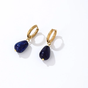 Macro shot of gold hoop earrings featuring teardrop navy blue synthetic stone pendants