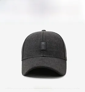 Front view of dark grey winter baseball cap featuring logo patch and embroidery details