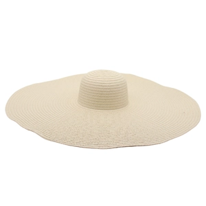 Close-up of finely woven oversized straw hat texture showing wave-shaped wide brim
