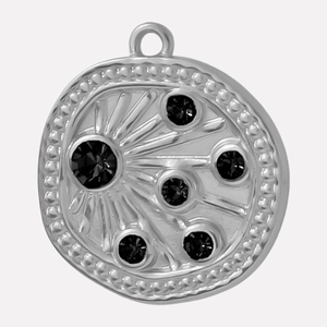 Close-up of 304 stainless steel sunburst pendant with black rhinestone inlay details