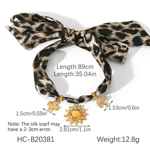 Leopard print ribbon necklace with sun and cross pendants showing dimensions and weight
