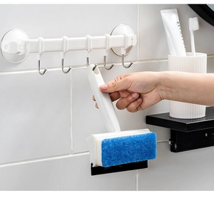 Close-up of 3-in-1 bathroom cleaning tool with sponge head and window squeegee blade