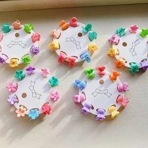 10-piece set of macaron-colored mini flower hair claws for girls on a display card