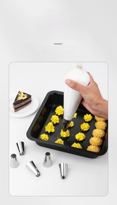 Stainless steel piping tips set showing hand decorating a cake with white cream