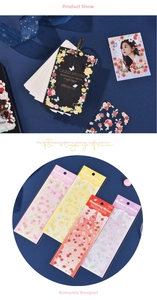 Close-up of vintage rose flower stickers and laser ribbons for scrapbook journaling