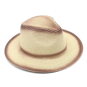 Detailed macro view showing the gradient straw weave texture of the Fedora sun hat