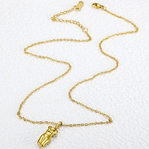 Minimalist gold stainless steel necklace with abstract female torso body pendant design